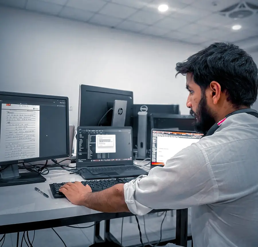 Ashar Ahmed at work at his desk